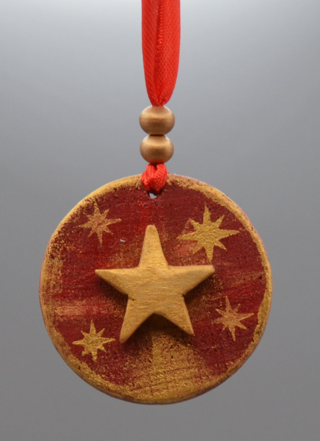 MÉDAILLON ÉTOILE ROUGE ET OR